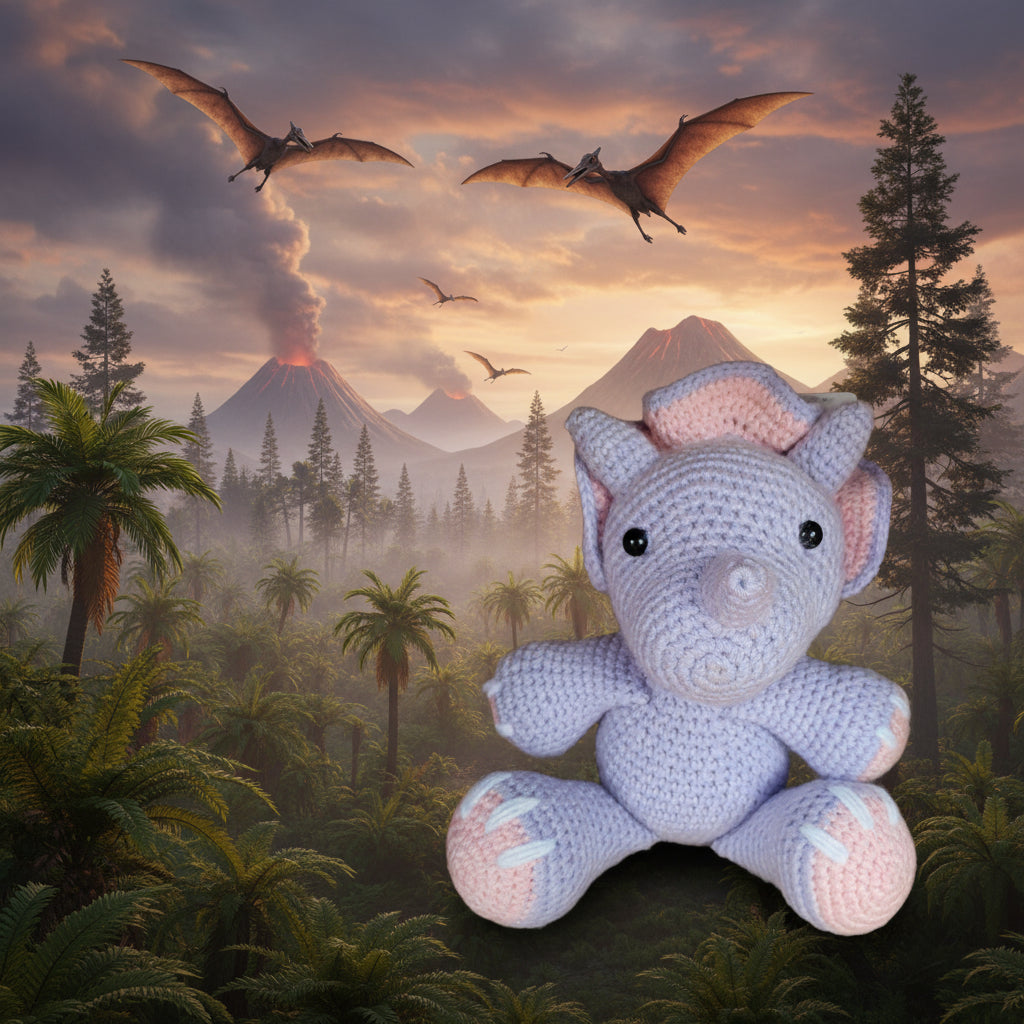 Crocheted dinosaur toy with pink and purple colors on a wooden surface